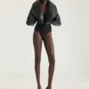 Boudoir-mules med klack i lackläder med fransar Boudoir-mules med klack i lackläder med fransar
