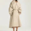 Lång trenchcoat i bomull med snitt Lång trenchcoat i bomull med snitt
