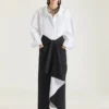 Midi-kjol i laminerad ull och mohair Midi-kjol i laminerad ull och mohair