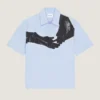 Skjorta i poplin med surrealistiskt tryck Skjorta i poplin med surrealistiskt tryck